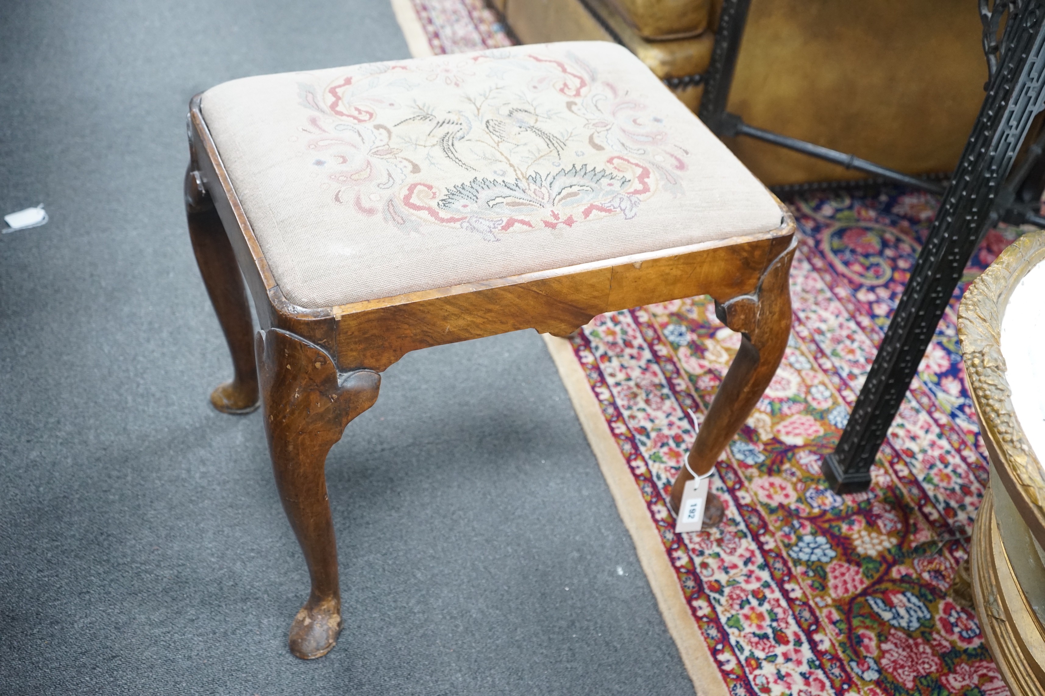 A Queen Anne revival walnut dressing stool, width 56cm, depth 45cm, height 48cm